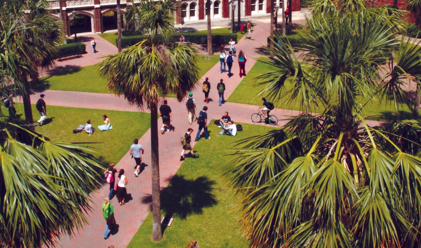 students walking across campus