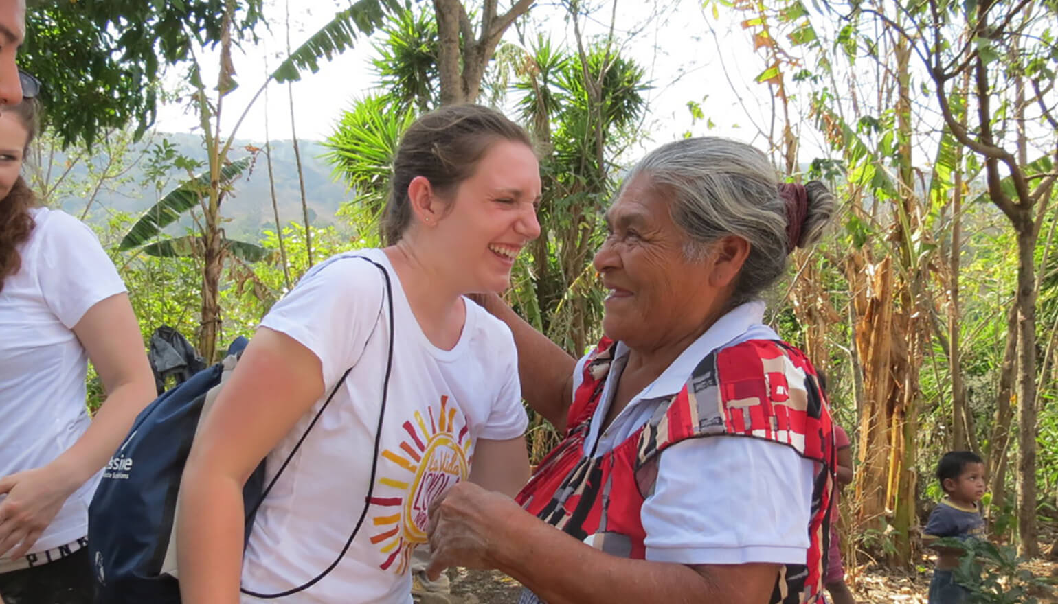 Student laughing with elderly widow