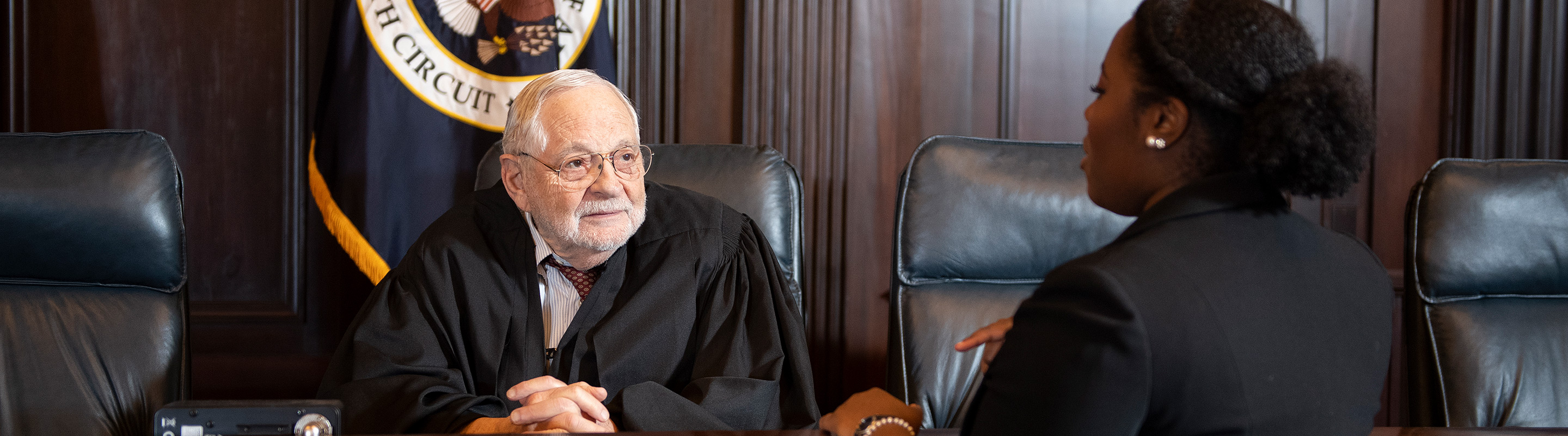 Attorney talking to judge in court setting