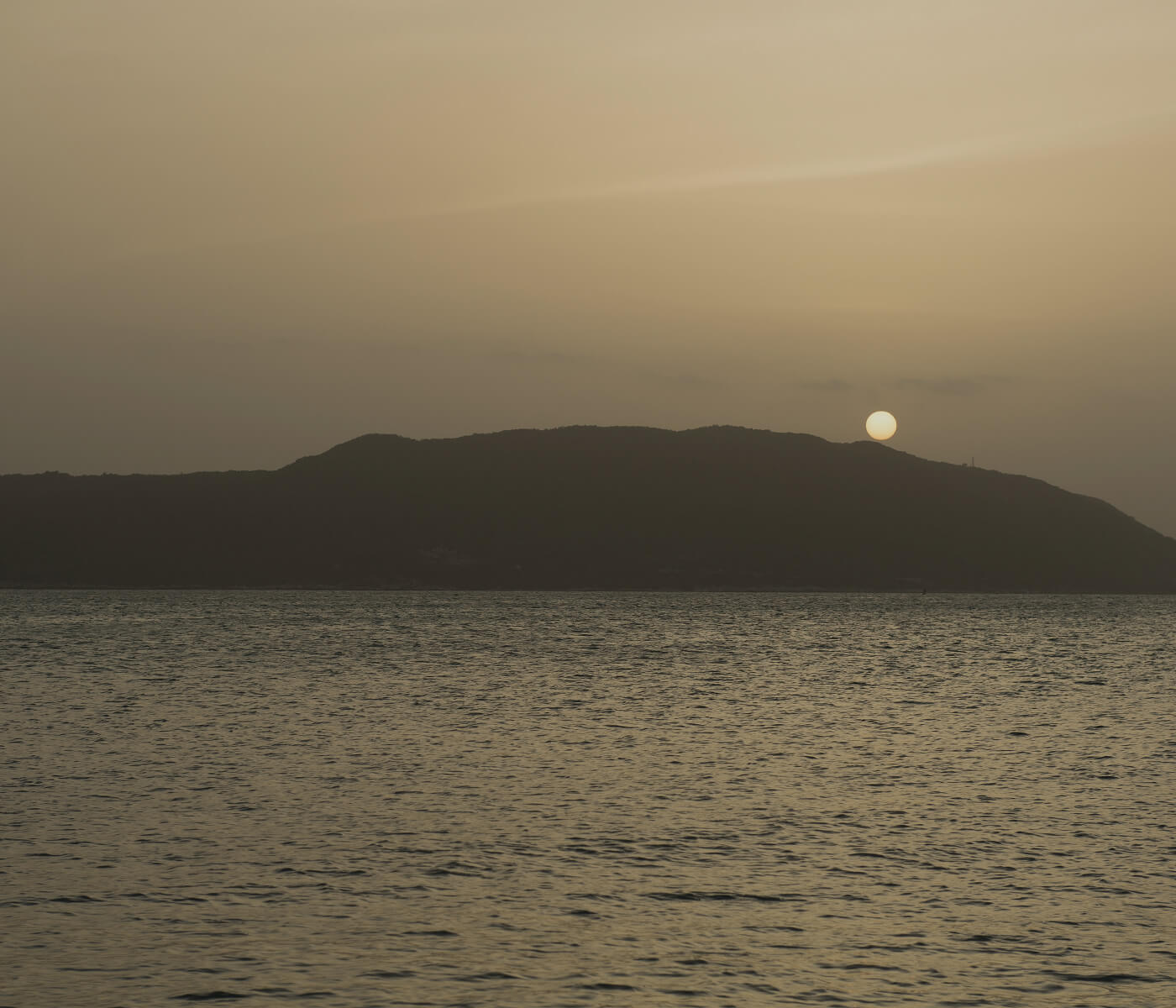 Image of ocean and hill
