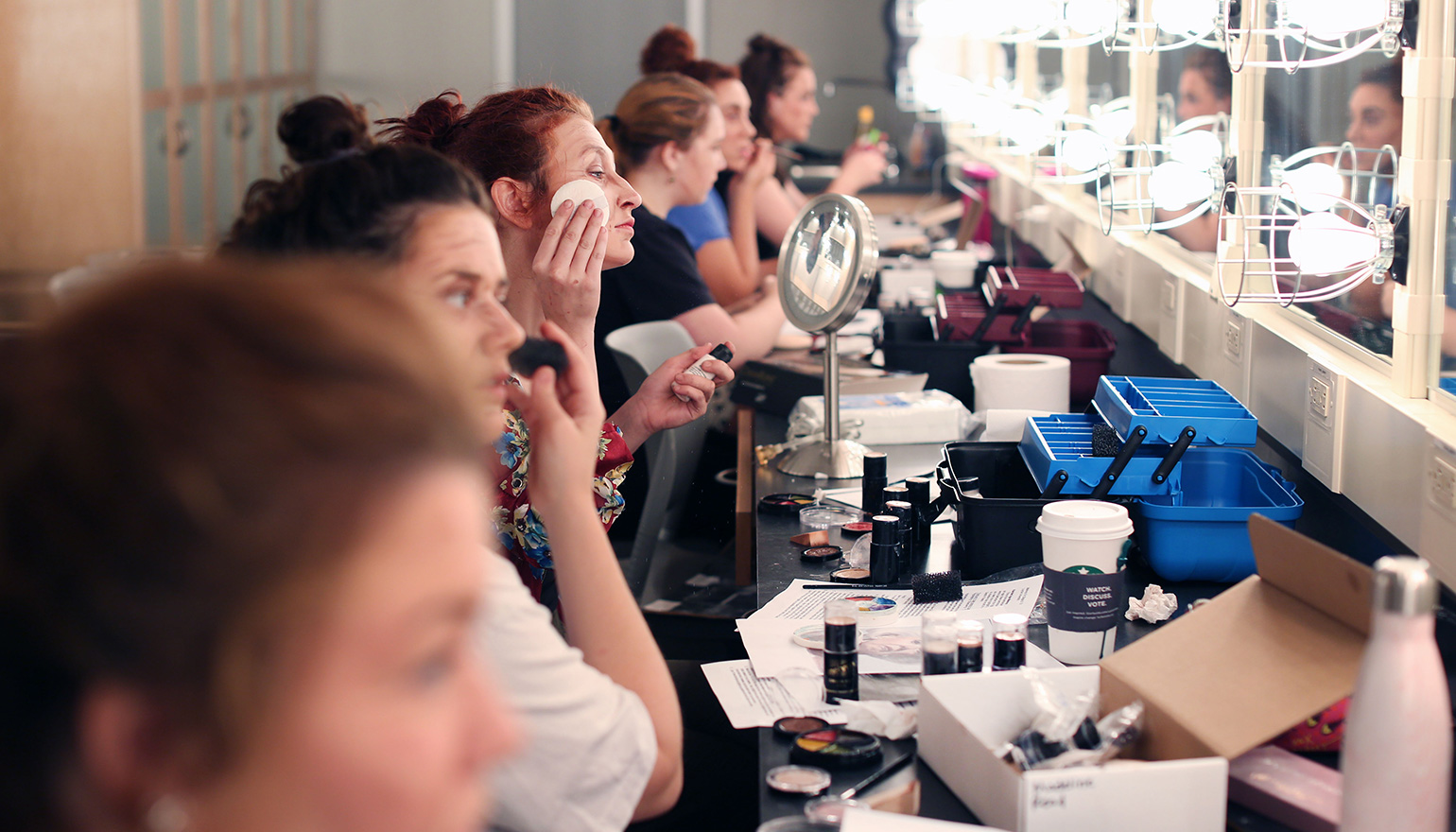 Students doing stage makeup