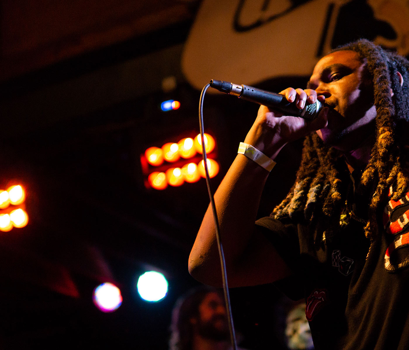 Student performing on stage at Tipitinas