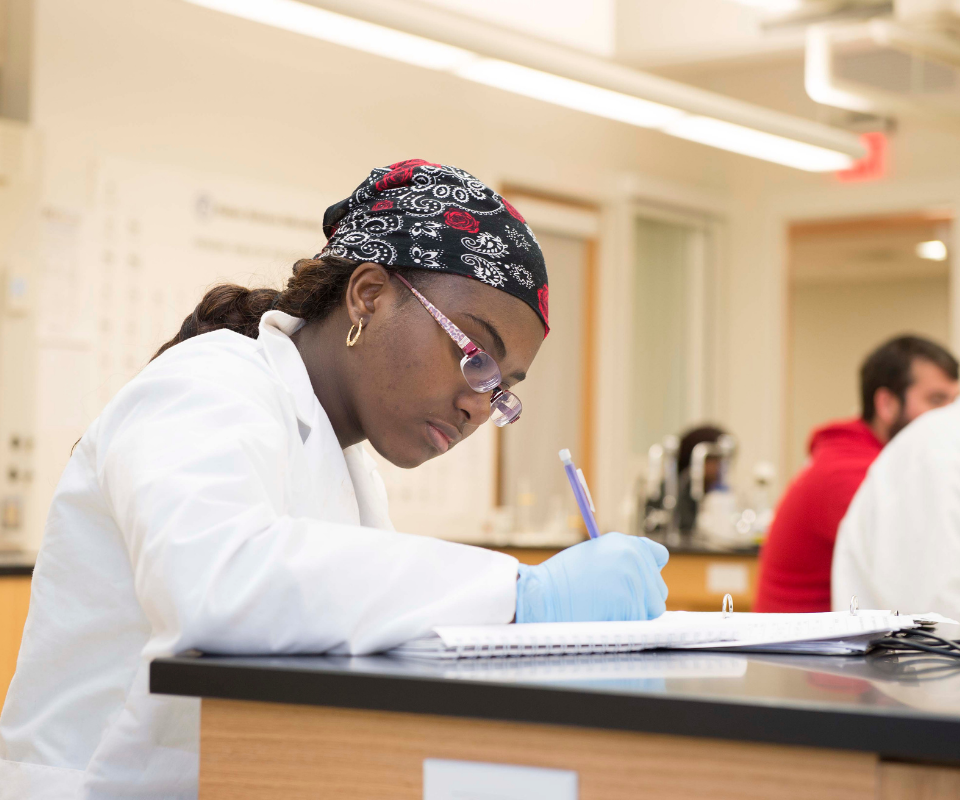 online RN to BSN student taking an exam.