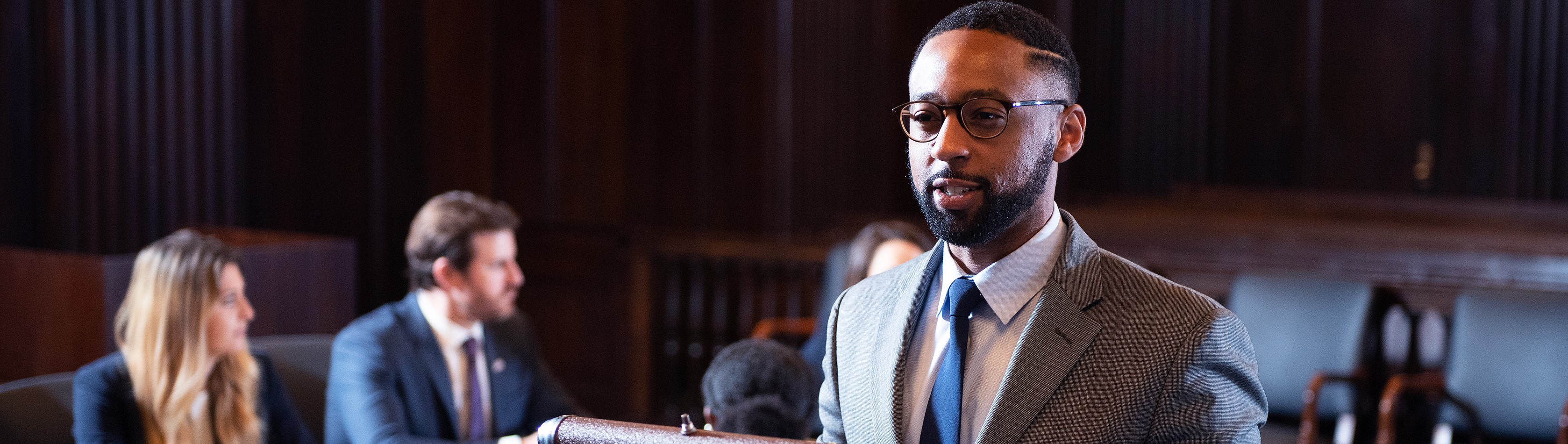 Online Master of Criminology and Justice student speaking in a courtroom.