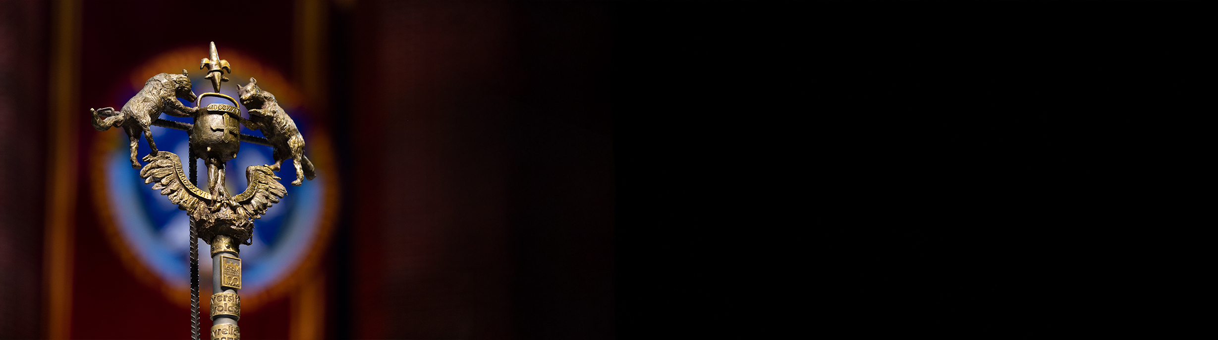 closeup of university mace at commencement ceremony