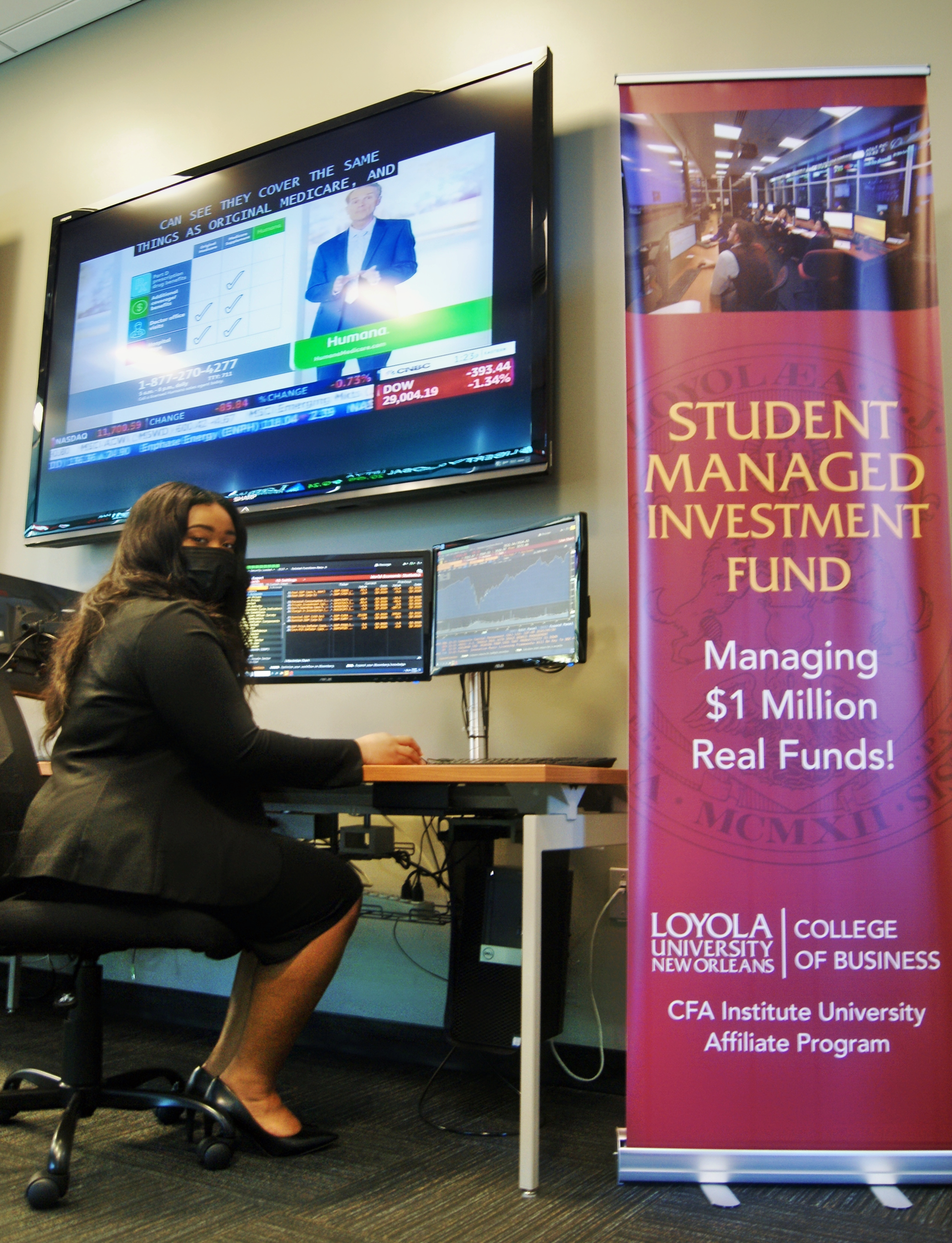 Loyola student Carrie Smith tries out the new Bloomberg Terminal at Loyola